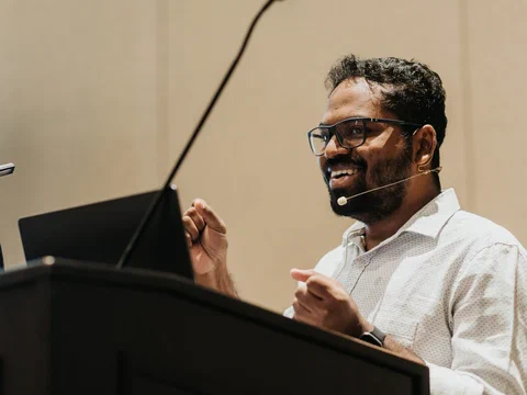 Kuldeep Pisda speaking at a conference